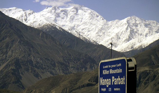 Nanga Parbat, the ninth-highest mountain in the world, is seen from the Karakorum Highway, leading to neighboring China, in Pakistan&#x27;s northern area. Gunmen wearing police uniforms killed nine foreign tourists and one Pakistani before dawn on Sunday, June 23, 2013, at the base camp on the mountain. (AP Photo/Musaf Zaman Kazmi)

