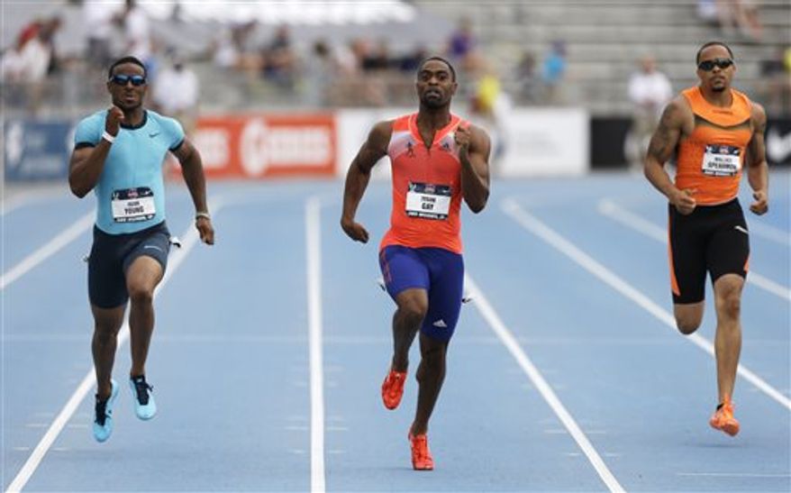 Tyson Gay, center, leads Isiah Young, left, and Wallace Spearmon, right, during the senior men's 200-meter dash finals at the U.S. Championships athletics meet on Sunday, June 23, 2013, in Des Moines, Iowa. Gay won the race. (AP Photo/Charlie Neibergall)