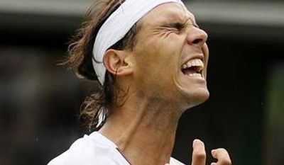 Rafael Nadal of Spain reacts as he loses a point to Steve Darcis of Belgium during their Men's first round singles match at the All England Lawn Tennis Championships in Wimbledon, London, Monday, June 24, 2013. (AP Photo/Kirsty Wigglesworth)