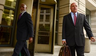 Stanley A. Straughter, left, leaves the United States District Court for the District of Columbia with his attorney Steven McCool, right, after pleading guilty to making straw donations as an investigation into a D.C. campaign finance  scheme continues, Washington, D.C., Monday, June 24, 2013. (Andrew Harnik/The Washington Times)