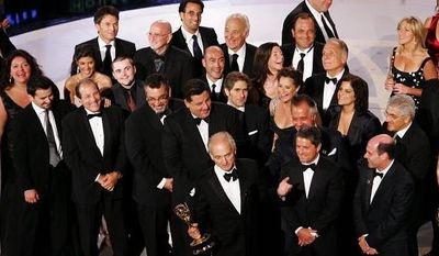 ** FILE ** In this 2007 file photo, &quot;Sopranos&quot; producer David Chase, holding the award for best drama series, was surrounded by the cast and crew of the mob drama at the 59th Primetime Emmy Awards in Los Angeles. (Associated Press)