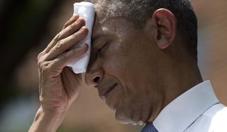 ** FILE ** President Obama wipes away sweat during a speech at Georgetown University on June 25, 2013. (Associated Press)