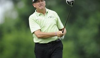 Ken Duke watches his tee shot on the 15th tee during the first round of the AT&amp;T National Golf tournament, Thursday, July 27, 2013, in Bethesda, Md. (AP Photo/Nick Wass)
