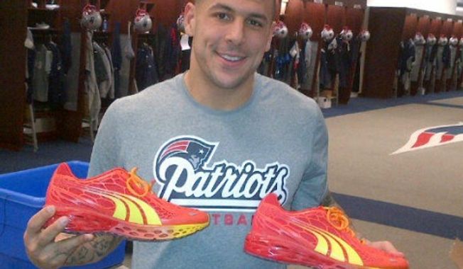 Former Patriots tight end and murder suspect shows off a pair of PUMA shoes for his Twitter followers. The company cut ties with Mr. Hernandez on Wednesday, June 27, 2013. (Twitter)