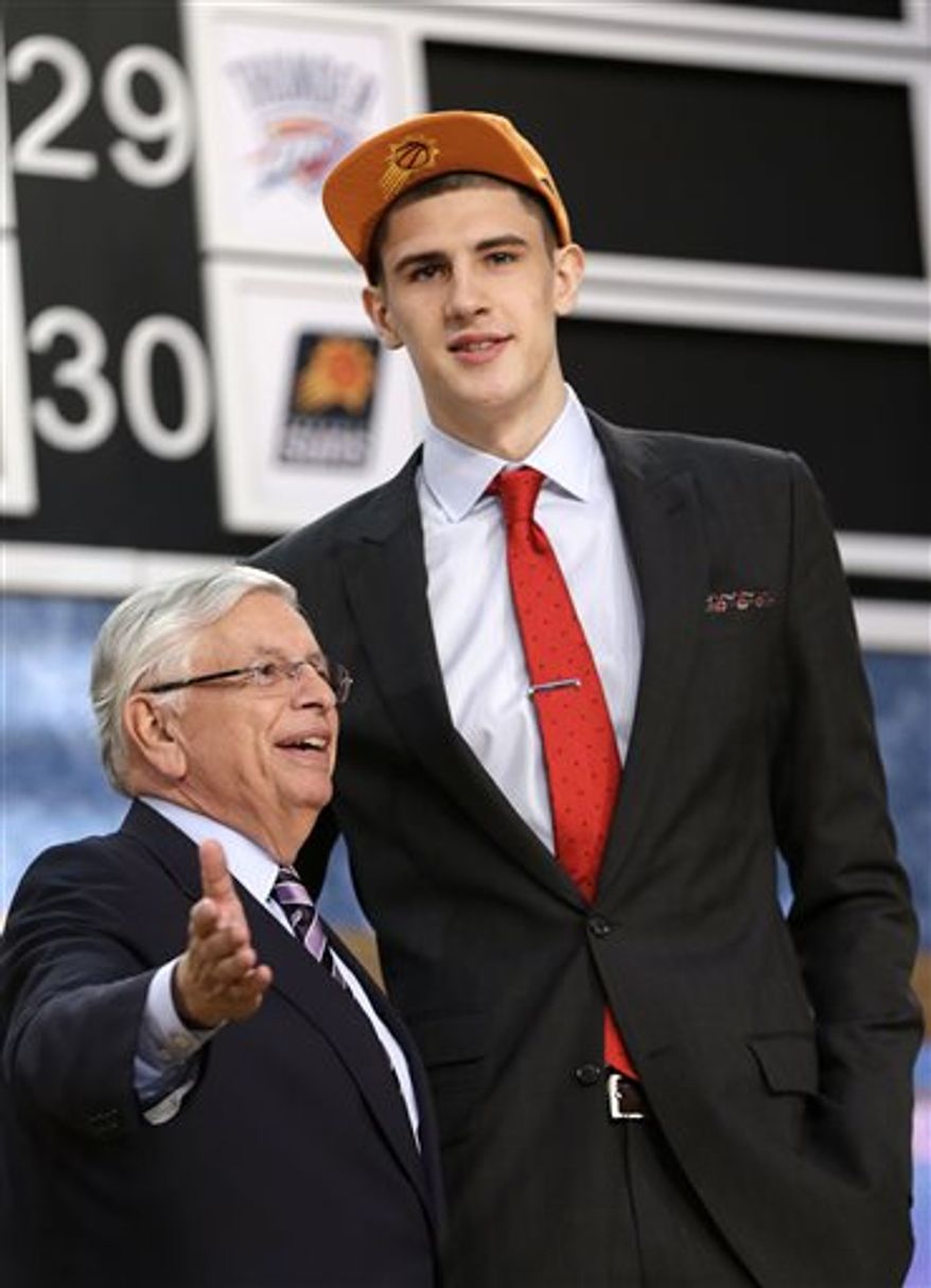 NBA Commissioner David Stern, left, poses with Alex Len, of Ukraine, who was selected by the Phoenix Suns in the first round of the NBA basketball draft, Thursday, June 27, 2013, in New York. (AP Photo/Kathy Willens)