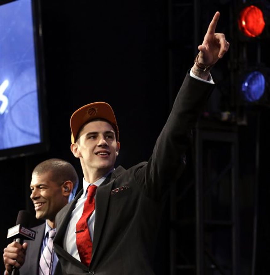 Alex Len, of Ukraine, gestures after being selected by the Phoenix Suns in the first round of the NBA basketball draft, Thursday, June 27, 2013, in New York. (AP Photo/Kathy Willens)