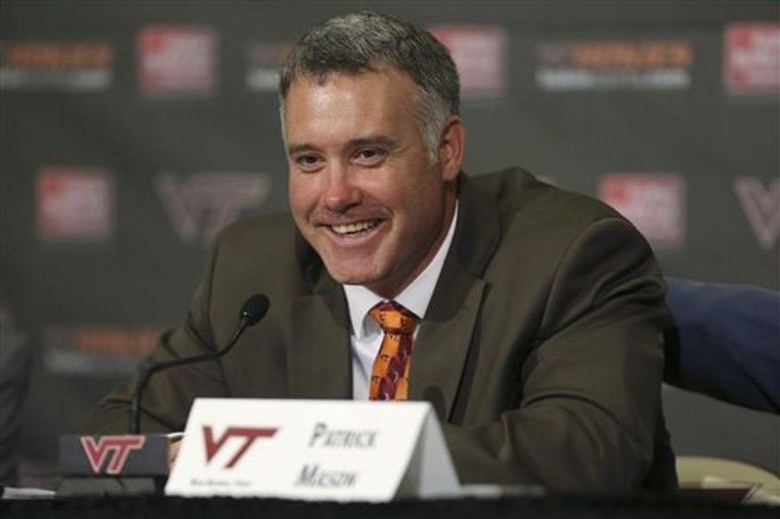 Patrick Mason smiles during his introduction as Virginia Tech baseball coach in Blacksburg, Va., Thursday, June 27 2013. Mason replaces Pete Hughes, who left after seven seasons to coach at Oklahoma. (AP Photo/The Roanoke Times, Matt Gentry)
