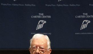 Former President Jimmy Carter presents his opening remarks during a conference on advancing women&#x27;s rights, at the Carter Center on Friday, June 28, 2013, in Atlanta. (AP Photo/Jaime Henry-White)