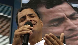 ** FILE ** Ecuadorean President Rafael Correa sings during his weekly live broadcast, &quot;Enlace Ciudadano,&quot; or &quot;Citizen Link,&quot; in Manta, Ecuador, on Saturday, June 29, 2013. (AP Photo/Martin Mejia)