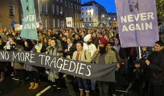 Several thousand abortion-rights protesters march through central Dublin on Saturday, Nov. 17, 2012, to demand that Ireland&#39;s government allow abortions to save a woman&#39;s life. (AP Photo/Shawn Pogatchnik)