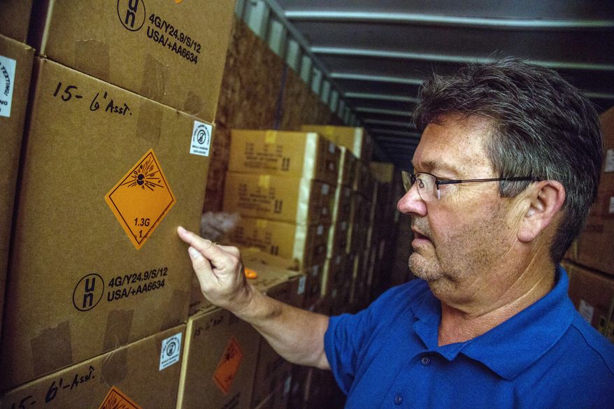 Dominion Fireworks owner William Bulifant explains different fireworks grades. Business has "grown leaps and bounds," he says. "I do still get excited. It's very cool." (Andrew S. Geraci/The Washington Times)