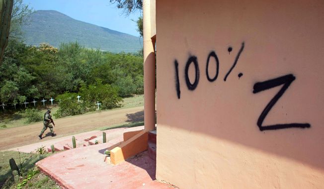 Los Zetas appears to have left a message for rival gang Caballeros Templarios, or Knights Templar, in the form of vandalism of a temple in Michoacan state, Mexico. (Associated Press)