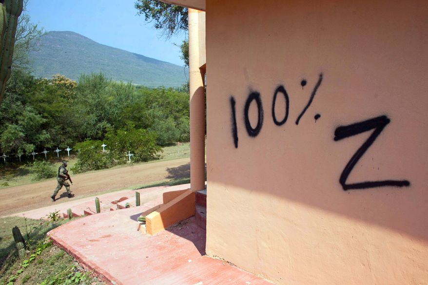Los Zetas appears to have left a message for rival gang Caballeros Templarios, or Knights Templar, in the form of vandalism of a temple in Michoacan state, Mexico. (Associated Press)