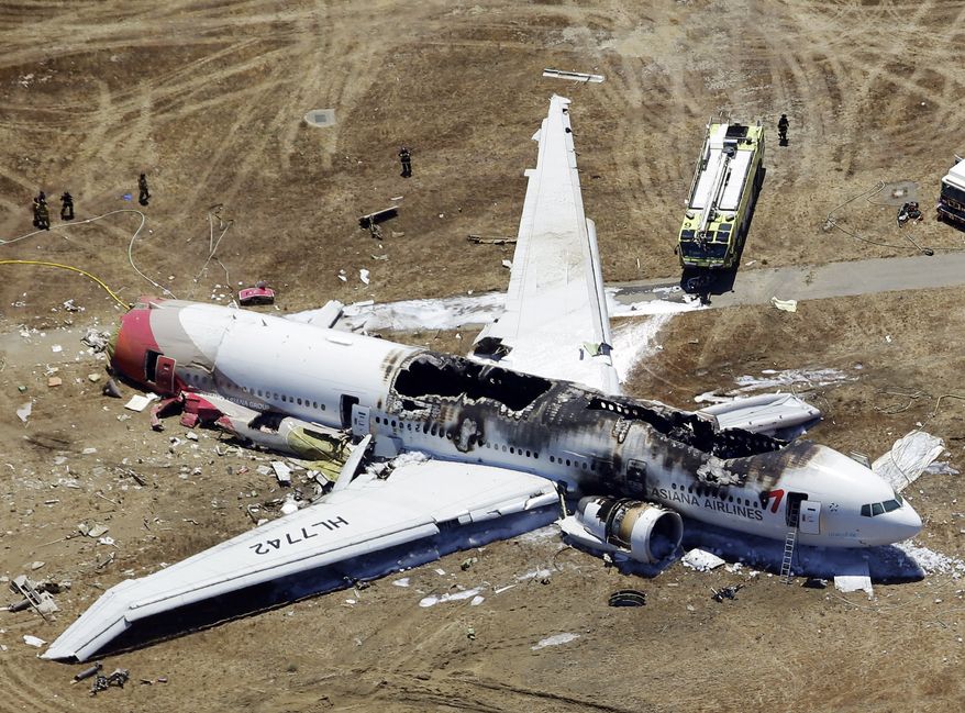 The wreckage of an Asiana Airlines Boeing 777 is pictured after it crashed while landing at the San Francisco International Airport in San Francisco on Saturday, July 6, 2013. (AP Photo/Marcio Jose Sanchez)