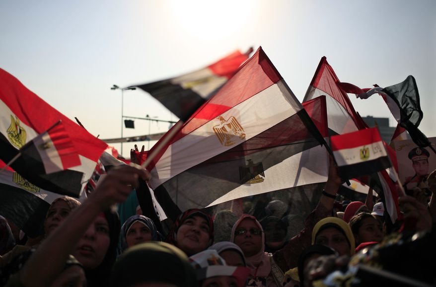 Opponents of ousted Egyptian President Mohammed Morsi rally in Tahrir Square in Cairo on Sunday, July 7, 2013. The country's new leadership wrangled over the naming of a prime minister, as both the Muslim Brotherhood and their opponents called for new mass rallies Sunday, renewing fears of another round of street violence over the military's ousting of Islamist President Mohammed Morsi. (AP Photo/Khalil Hamra)