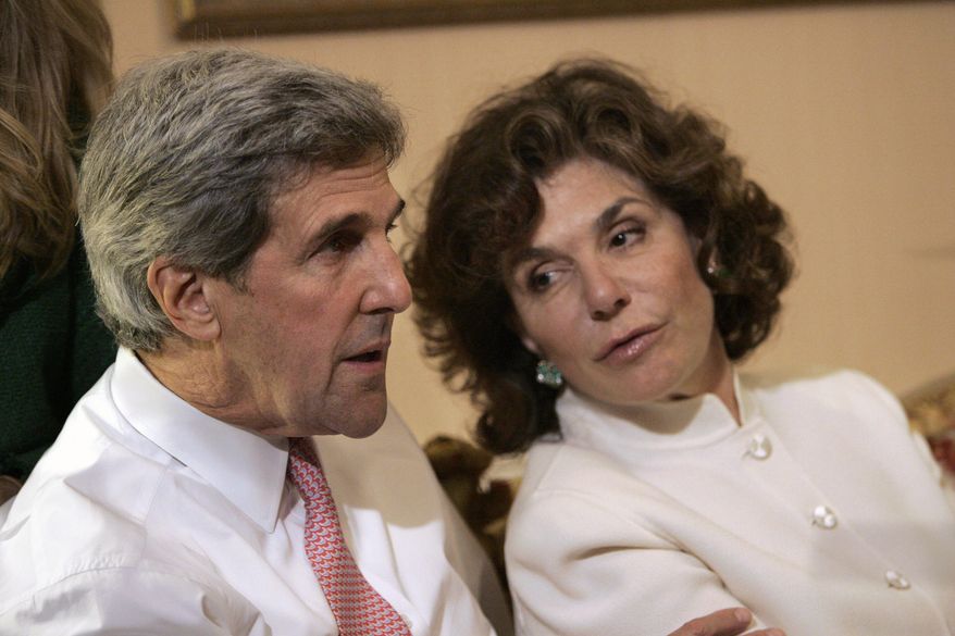 In a Tuesday, Nov. 4, 2008, file photo, Sen. John Kerry, D-Mass, left, talks with his wife Teresa Heinz Kerry while watching election results at a hotel in Boston, in Boston. (AP Photo/Michael Dwyer, File)