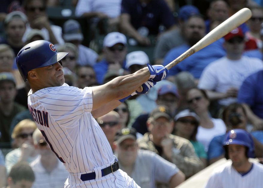 Chicago Cubs' Scott Hairston hits a two-run home run during the second inning of a baseball game against the Pittsburgh Pirates in Chicago, Friday, July 5, 2013. (AP Photo/Nam Y. Huh)