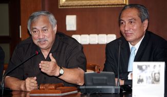 **FILE** Delegate Eni Faleomavaega (left), a non-voting congressman from the American Samoa, speaks during a joint press conference with Indonesian legislator Theo Sambuaga (right) in Jakarta, Indonesia, on July 4, 2007. (Associated Press)