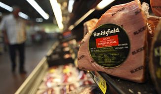 **FILE** A Smithfield ham is seen Sept. 6, 2011, at a grocery store in Richardson, Texas. (Associated Press)