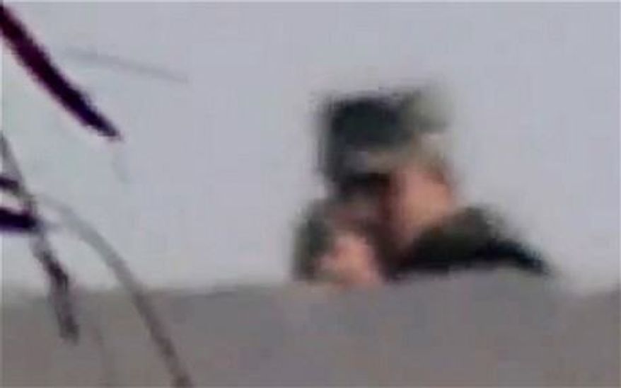 Egyptian newspaper photographer Ahmed Samir Assem captured his own death on film, July 9, 2013. An Egyptian solider is seen turning his rifle towards the camera and firing a moment before the screen goes black. (Screen shot Telegraph video)