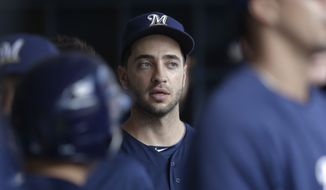 Milwaukee Brewers player Ryan Braun is seen in the dugout during the first inning of a baseball game against the Cincinnati Reds on Wednesday, July 10, 2013, in Milwaukee. (AP Photo/Morry Gash)