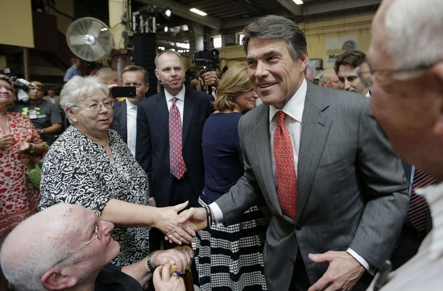 **FILE** Texas Gov. Rick Perry greets supporters July 8, 2013, as he leaves Holt Cat in San Antonio after announcing he will not seek re-election. A staunch Christian conservative, proven job-creator and fierce defender of states' rights, Perry has been in office nearly 13 years, making him the nation's longest-sitting current governor. (Associated Press)