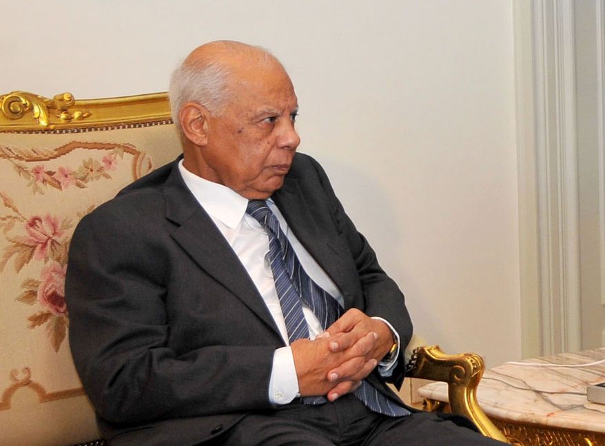 Hazem el-Biblawi, a prominent economist who this week was named Egyptian prime minister, meets with interim President Adly Mansour (not pictured) in Cairo on Tuesday, July 9, 2013. (AP Photo/Egyptian Presidency)