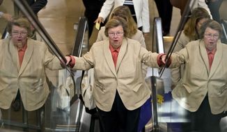 Senate Appropriations Committee Chair Sen. Barbara Mikulski, D-Md., rides an escalator in Washington, Wednesday, July 10, 2013, as senators rushed to the floor for a vote to end debate on the Democrats&#39; plan to restore lower interest rates on student loans one week after Congress&#39; inaction caused those rates to double. (AP Photo/J. Scott Applewhite)

