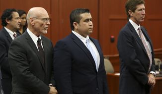 **FILE** Attorneys Don West (front left) and Mark O&#39;Mara (right) stand with George Zimmerman as the selected jurors enter the courtroom during Zimmerman&#39;s trial in Seminole Circuit Court in Sanford, Fla., on June 20, 2013. (Associated Press/Orlando Sentinel)