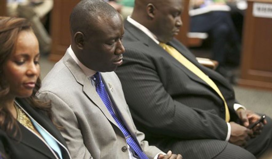** FILE ** Attorneys Natalie Jackson, Benjamin Crump, and Daryl Parks, from left, sit in for the Trayvon Martin family during George Zimmerman&#x27;s trial in Seminole circuit court in Sanford, Fla. on Saturday, July 13, 2013. Jurors found Zimmerman not guilty of second-degree murder in the fatal shooting of 17-year-old Trayvon in Sanford, Fla. The six-member, all-woman jury deliberated for more than 15 hours over two days before reaching their decision. (AP Photo/Gary W. Green, Pool)