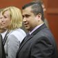 George Zimmerman leaves Seminole Circuit Court with his family on Saturday, July 13, 2013, in Sanford, Fla., after a jury found him not guilty of second-degree murder in the fatal shooting of 17-year-old Trayvon Martin. (AP Photo/Joe Burbank, Pool)