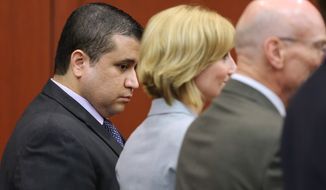 ** FILE ** George Zimmerman looks down as he stands next to defense co-counsels (from second from left) Lorna Truett, Don West and Mark O&#39;Mara as Mr. Zimmerman is found not guilty in the Seminole Circuit Court in Sanford, Fla., on Saturday, July 13, 2013. Mr. Zimmerman was cleared of all charges in the shooting death of Trayvon Martin, the unarmed black teenager whose killing unleashed a furious debate across the U.S. over racial profiling, self-defense and equal justice. (AP Photo/Orlando Sentinel, Joe Burbank, Pool)