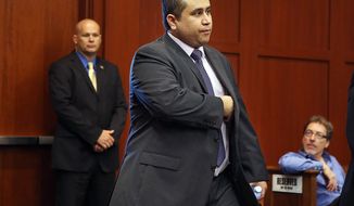 George Zimmerman enters the courtroom for his trial before the jury continued deliberations in Seminole Circuit Court in Sanford, Fla., on Saturday, July 13, 2013. Mr. Zimmerman had been charged in the 2012 shooting death of Trayvon Martin. (AP Photo/Orlando Sentinel, Gary W. Green, Pool)