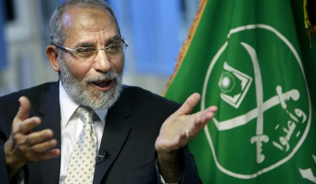 ** FILE ** In this Tuesday, Oct. 26, 2010, file photo, Muslim Brotherhood supreme leader Mohammed Badie talks during an interview with the Associated Press at his office in Cairo Egypt. (AP Photo/Amr Nabil, File)