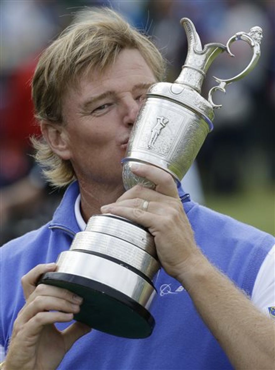 FILE - In this July 22, 2012 file photo, Ernie Els kisses the Claret Jug trophy after winning the British Open Golf Championship at Royal Lytham & St Annes golf club in Lytham St Annes, England. Over the last five years, 18 players have won the last 20 majors. The next chance is the 142nd British Open, which returns July 18 to Muirfield for the 16th time dating to 1892. (AP Photo/Chris Carlson)