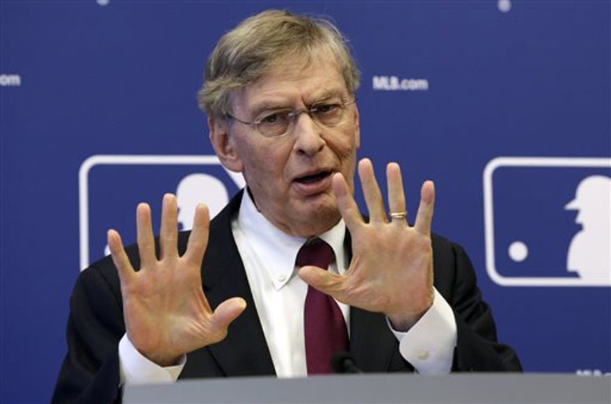 FILE - In this May 16, 2013 file photo, commissioner Bud Selig answers a question during a news conference at Major League Baseball headquarters, in New York. Selig insists "this sport is cleaner than it's ever been." Speaking Monday, July 15, 2013, during a question-and-answer session arranged by Politico, Selig defended baseball's drug-testing program, which began for the 2003 season. (AP Photo/Richard Drew, File)