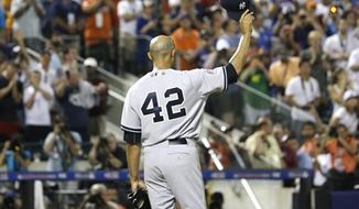 American League’s Mariano Rivera, of the New York Yankees, acknowledges a standing ovation during the eighth inning of the MLB All-Star baseball game, on Tuesday, July 16, 2013, in New York. (AP Photo/Matt Slocum)