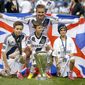 ** FILE ** Los Angeles Galaxy&#39;s David Beckham, top center, of England, poses with his sons, from left, Brooklyn, Romeo and Cruz after the Galaxy&#39;s 3-1 win in the MLS Cup championship soccer match against the Houston Dynamo in Carson, Calif., Saturday, Dec. 1, 2012. (AP Photo/Jae C. Hong)