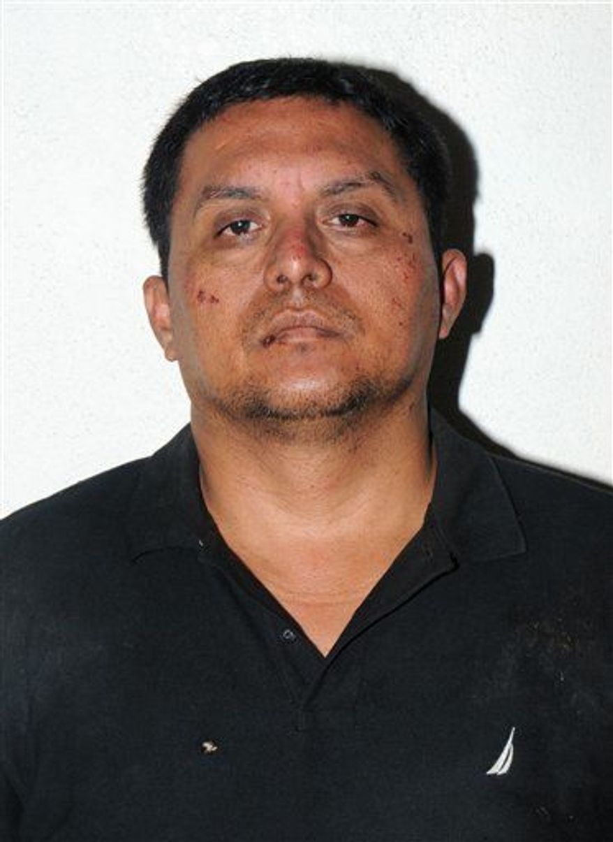 Zetas drug cartel leader Miguel Angel Trevino Morales is shown in the Tuesday, July 16, 2013 photo after his arrest in Mexico. Trevino Morales, 40, was captured before dawn Monday by Mexican marines who intercepted a pickup truck with $2 million in cash in the countryside outside the border city of Nuevo Laredo, which has long served as the Zetas' base of operations. (AP Photo/Mexican Navy)