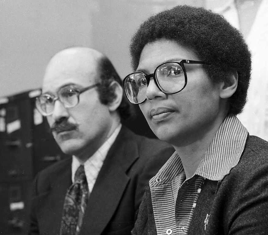 **FILE** Rower Anita DeFrantz, right, announces an athlete's suit against the U.S. Olympic Committee for depriving Americans the opportunity to compete in the Moscow Games at a news conference in New York City, Wednesday, April 24, 1980. A number of athletes joined the 1976 Olympic bronze medalist in the suit filed in Washington, D.C. At left is Ira Glasser, executive director of the American Civil Liberties Union. (AP Photo/Burnett)