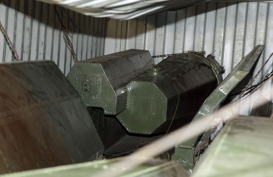 Military equipment lays in containers aboard a North Korean-flagged ship at the Manzanillo International container terminal on the coast of Colon City, Panama, Tuesday, July 16, 2013. A North Korean ship carrying weapons system parts buried under sacks of sugar was seized as it tried to cross the Panama Canal on its way from Cuba to its home country, which is under a United Nations arms embargo, Panamanian officials said Tuesday. (AP Photo/Arnulfo Franco)
