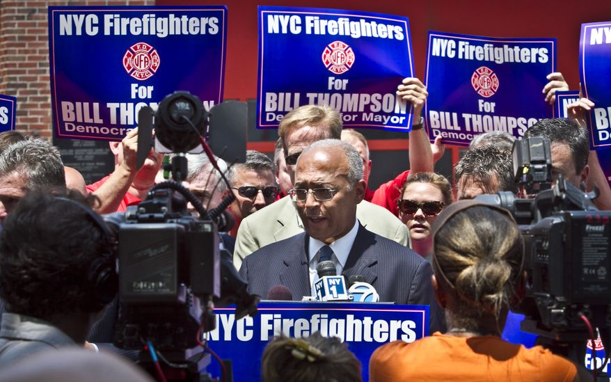 William C. Thompson (center), a Democratic candidate for New York mayor, speaks after receiving the firefighters union's endorsement on Tuesday, July 9, 2013, in New York. (AP Photo/Bebeto Matthews)