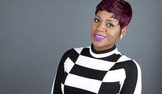 ** FILE ** This April 24, 2013, photo shows American R&amp;B singer Fantasia Barrino posing for a portrait in New York. Barrino will star in the Broadway-bound “After Midnight,&quot; a musical revue celebrating Duke Ellington&#39;s years at the famous Cotton Club nightclub in Harlem. (Photo by Amy Sussman/Invision/AP, File)