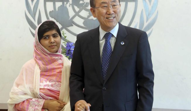 United Nations Secretary-General Ban Ki-moon, right, holds Malala Yousafzai&#x27;s hand while posing for photographers, Friday, July 12, 2013, at United Nations headquarters. Malala Yousafzai, the Pakistani teenager shot by the Taliban for promoting education for girls, celebrated her 16th birthday on Friday addressing the United Nations. (AP Photo/Mary Altaffer)