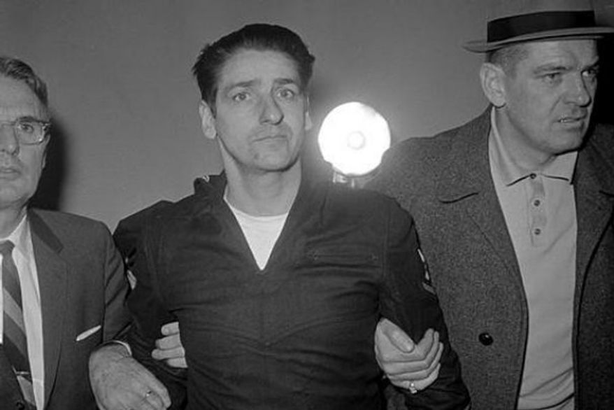 ** FILE ** Albert DeSalvo, who says he strangled 13 women in the Boston area, is pictured minutes after his capture in Lynn, Mass., Feb. 25, 1967, north of Boston. (Associated Press)