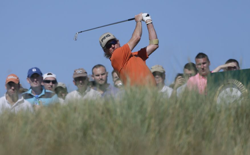 Miguel Angel Jimenez of Spain plays a shot from the 15th tee during the second round of the British Open Golf Championship at Muirfield, Scotland, Friday July 19, 2013. (AP Photo/Jon Super)