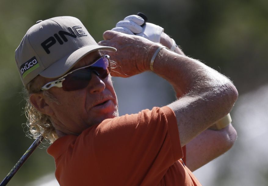 Miguel Angel Jimenez of Spain plays a shot off the 10th tee during the second round of the British Open Golf Championship at Muirfield, Scotland, Friday July 19, 2013. (AP Photo/Jon Super)