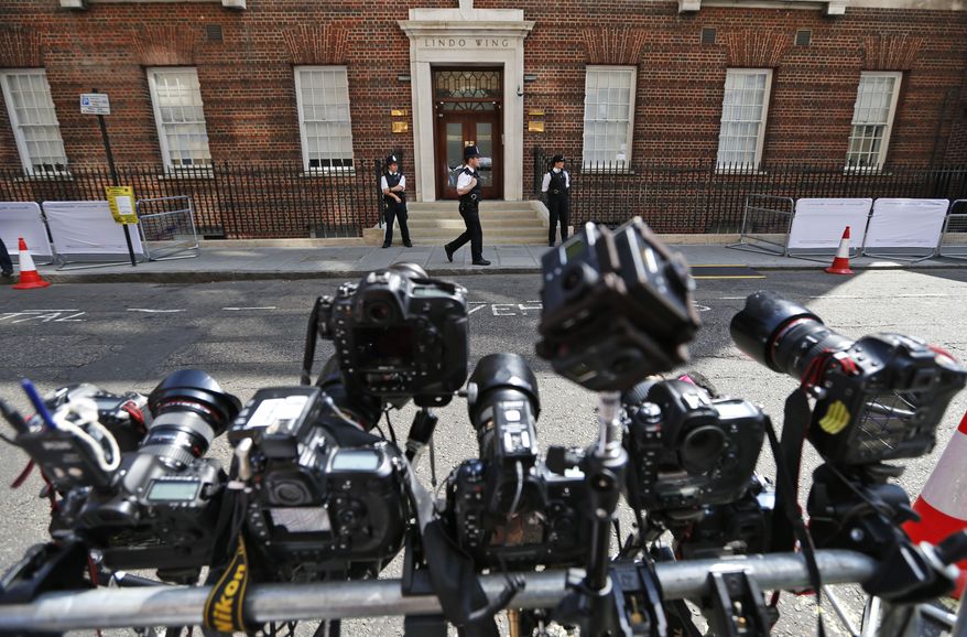 Remote-controlled cameras are set up across St. Mary's Hospital exclusive Lindo Wing in London, Monday, July 22, 2013. Buckingham Palace officials say Prince William's wife, Kate, has been admitted to the hospital in the early stages of labour. Royal officials said that Kate traveled by car to St. Mary's Hospital in central London. Kate _ also known as the Duchess of Cambridge _ is expected to give birth in the private Lindo Wing of the hospital, where Princess Diana gave birth to William and his younger brother, Prince Harry. The baby will be third in line for the British throne _ behind Prince Charles and William _ and is anticipated eventually to become king or queen. (AP Photo/Lefteris Pitarakis)