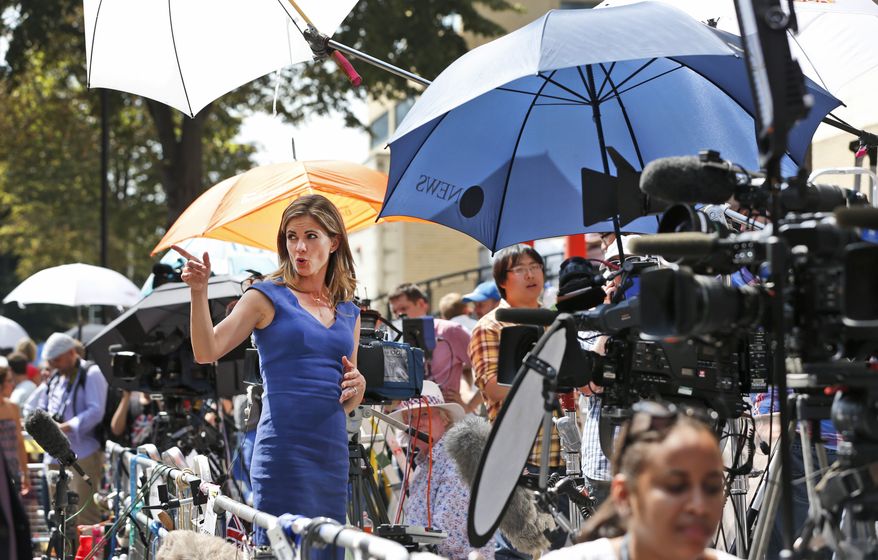 Broadcaster Natalie Morales, of NBC, broadcasts a live report, across from St. Mary's Hospital exclusive Lindo Wing in London, Monday, July 22, 2013. Buckingham Palace officials say Prince William's wife, Kate, has been admitted to the hospital in the early stages of labour. Royal officials said that Kate traveled by car to St. Mary's Hospital in central London. Kate _ also known as the Duchess of Cambridge _ is expected to give birth in the private Lindo Wing of the hospital, where Princess Diana gave birth to William and his younger brother, Prince Harry.The baby will be third in line for the British throne _ behind Prince Charles and William _ and is anticipated eventually to become king or queen. (AP Photo/Lefteris Pitarakis)