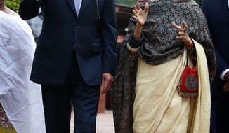 U.S. Vice President Joe Biden, left, gestures as he talks with Mahatma Gandhi’s granddaughter, Tara Gandhi, during a visit to a museum dedicated to the Indian independence hero Mahatma Gandhi in New Delhi, India, Monday, July 22, 2013. (AP Photo/Saurabh Das)


